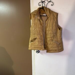 Tan puffer hooded vest.
